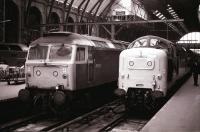 Deltic 55013 <I>The Black Watch</I> stands at Kings Cross alongside 47528 in June 1978.<br><br>[Peter Todd 27/06/1978]