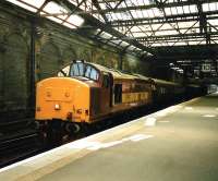 EWS 37 413 eases <I>The Royal Scotsman</I> over the scissors crossover and into the old Platform 10 in July 1999.<br><br>[David Panton /07/1999]