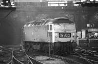 The driver of 47547 looks back from the cab window as he slowly reverses onto his train at Kings Cross on 20 March 1976.<br><br>[John McIntyre 20/03/1976]