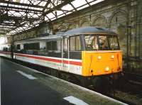 86 244 <I>The Royal British Legion</I> in BR <I>InterCity</I> livery awaits its departure time at the old Waverley Platform 10 in December 1994 with a train for Birmingham New Street.<br><br>[David Panton /12/1994]