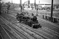 Standard class 4 2-6-4T no 80129 has just moved off Polmadie shed on its way to Glasgow Central to pick up empty stock in May 1959. The locomotive is about to pass 'Dixon's Blazes', site of the last operational blast furnace within the City of Glasgow, closed down the previous year. <br><br>[A Snapper (Courtesy Bruce McCartney) 16/05/1959]