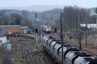 I can just imagine the driver of the Freightliner pulling out his newspaper and perhaps reaching for a Thermos. The southbound loaded coal train was paused here while a number of Voyagers and Pendolinos sped past.<br><br>[Ewan Crawford 28/01/2010]