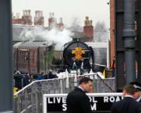 A1 no 60163 'Tornado' at the head of the Royal Train having recently arrived from Preston at Manchester Liverpool Road station, now part of the Museum of Science and Industry. The photo is taken from Lower Byrom Street looking west through the gates of the museum. The chimneys on the roof of the building behind the loco are part of the station building.<br><br>[John McIntyre 04/02/2010]