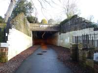 The refurbished Alloway Tunnel, recently cleaned up, re-lit, resurfaced and reopened as a cycle path [see image 25400]. View into the tunnel looking back from the Doon Viaduct on 6 February 2010.The old telegraph wire insulator arms can still be seen on the wall to the left, together with a new plaque marking the site of the well (beyond the fence) <I>Whare Mungo's mither hang'd hersel'</I> in <I>Tam O'Shanter</I>.<br><br>[Colin Miller 06/02/2010]