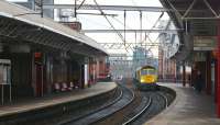 Deansgate station, Manchester, looking east towards Oxford Road on 4 February 2010. Freightliner 66576 is about to run through the westbound platform light engine heading for Trafford Park container terminal. <br>
<br><br>[John McIntyre 04/02/2010]