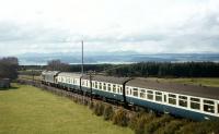 The driver breasting the summit at Culloden Moor in the 1970s will be pleased to see Inverness in the distance - and no more gradients for his ill-suited Class 40 to tackle before journey's end.<br><br>[Frank Spaven Collection (Courtesy David Spaven) //]