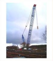 <I>See me!</I> The fully assembled 1000 tonne crane stands alongside Carrbridge station on 12 February 2010 ready for <I>the big lift</I> [see image 1503].<br><br>[Gus Carnegie 12/02/2010]