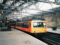 In April 1998 101 684 pulls out of Platform 3 at Glasgow Central with a Barrhead service. The rear train on the same platfrom is formed by a 158. I don't recall ever seeing a ScotRail 158 at Central before December 2009 when they started to be employed on the enhanced Shotts line services. I can only assume this is an Anglo-Scottish operator's unit, still in Regional Railways livery.<br>
<br><br>[David Panton /04/1988]