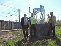 ScotRail's external relations manager John Yellowlees, Bill Thomson and Neil Fraser from the Rotary Club of Portobello, and artist Kenny Munro, with the new sculpture at Newcraighall station. [See news item]<br><br>[ScotRail 29/05/2012]