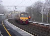 320 302 with a Helensburgh - Drumgelloch service at Dalreoch on 17 February<br><br>[David Panton 17/02/2010]
