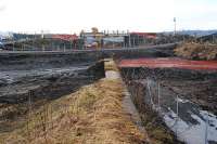 The roadbridge to the west of the former Westcraigs station is being re-built. This view is from the old loading bank. [See image 25382]<br><br>[Ewan Crawford 17/02/2010]