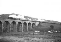 A2 Pacific no 60528 <I>Tudor Minstrel</I> takes The Warwickshire Railway Society 'Waverley Railtour' north onto Shankend viaduct in December 1965.<br><br>[Robin Barbour Collection (Courtesy Bruce McCartney) 11/12/1965]