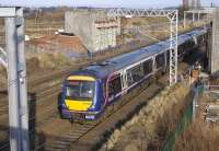 170402 on an Edinburgh-Glasgow Queen Street service on 21 February passes the abutments of the tramway bridge currently being built across the tracks at Saughton.<br>
<br><br>[Bill Roberton 21/02/2010]