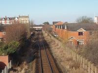 There is little trace these days of the four tracks that used to pass through Ansdell and Fairhaven, the houses on the right of this picture having been built on the old trackbed. This view looks west from a modern footbridge and the remaining face of the island platform can be seen beyond the road bridge. Unfortunately the scheduled service to Blackpool South did not appear for the picture. <br><br>[Mark Bartlett 22/02/2010]