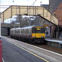 318 256 with a service for Dalmuir stands at Uddingston on 17 February 2010<br><br>[David Panton 17/02/2010]