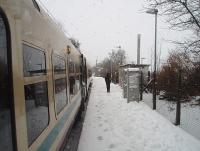 A lone passenger alights from a Wemyss Bay bound EMU at IBM and trudges off through the falling snow towards the exit. Does any other UK station have a name that is just made up of initials? <br><br>[Mark Bartlett 25/02/2010]