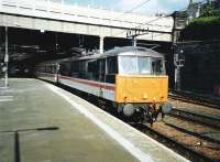 86 244 <I>The Royal British Legion</I> pulls out of platform 11 at Edinburgh Waverley in May 1997 with the 1710 service  to Birmingham New Street.<br><br>[David Panton /05/1997]