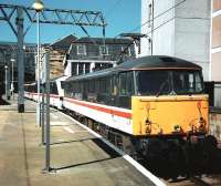 87014 pulls out of Platform 1 at Glasgow Central with the 1615 to London Euston on 1 June 1997. The locomotive is carrying the name <I>Knight of the Thistle</I>, being both a member of a most noble and ancient Scottish Order, as well as the name of the winner of the 1897 Royal Hunt Cup. The last locomotive to carry the name, A3 Pacific no 60065, while named after the latter, got into trouble because of the former [see image 22899].<br><br>[David Panton 01/06/1997]