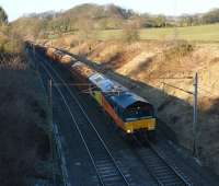 Colas Rail 66843 is now operating on its own on the Carlisle to Chirk log train. It is seen on 4 March 2010 heading south at Forton near Bay Horse. <br>
<br><br>[John McIntyre 04/03/2010]