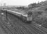 The Edinburgh-Glasgow push-pull sets were normally sandwiched between two class 27 BRCW Type 2s. On this occasion however class 25s are the traction on an Edinburgh bound service heading passed Cowlairs East Junction. The locomotives are 7581 leading and 7590 on the rear. The photograph was taken from the former Caledonian Railway viaduct that spanned the E&G line at the north end of Eastfield shed [see image 9082].<br><br>[John McIntyre 16/09/1972]