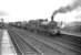 J36 0-6-0 no 65303 pulls up at Inverurie with a freight in March 1959. Immediately behind the J36 is Barclay diesel-hydraulic no D2414, at that time a recent addition to the allocation of Keith shed.<br><br>[Robin Barbour Collection (Courtesy Bruce McCartney) 26/03/1959]