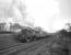 Beattock banker BR standard class 4 2-6-4T no 80045 passing the site of Auchencastle station on the back of a freight circa April 1965. The former station at Auchencastle opened in 1900 and was closed sometime between the wars.<br><br>[Robin Barbour Collection (Courtesy Bruce McCartney) /04/1965]