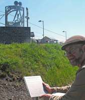 Artist Kenny Munro, from Craigmillar Community Arts Centre, with his sculpture at Newcraighall station on 29 May 2012. [See news item]<br>
<br><br>[ScotRail 29/05/2012]