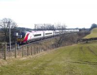 A northbound <i>Pendolino</i> at speed just south of bridge no 28 (Gretna to Westgillsyke Road) on the 09.30 London Euston to Glasgow Central at 12.55 on 10 March 2010. [See image 28054] <br><br>[Cyril Smith Collection (Courtesy Bill Jamieson) /03/2010]