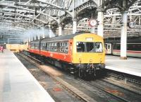 101 691 pulls away from platform 10 at Glasgow Central with a service for Paisley Canal on 2 June 1997.<br><br>[David Panton 02/06/1997]