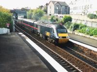 This September 1999 view at Inverkeithing was taken from the old <br>
footbridge near the south end of the platforms. It was removed a couple of years later when a fancier bridge with ramps and better accesses was built to the north. The right-hand backgound has also changed a fair bit since, and of course GNER, the operator of this 125 to Aberdeen, is history too (as even is its successor). <br>
<br><br>[David Panton /09/1999]