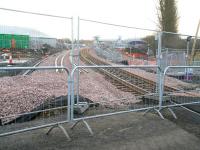 View east from the temporary level crossing at Bathgate towards the new station on Sunday 14 March 2010. The line into the current Bathgate terminus runs along this side of the large silver shed on the left.  <br><br>[John Furnevel 14/03/2010]