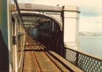 Entering the central section of the Tay Bridge headed towards Dundee one fine spring morning in 1980 [see image 33615].<br><br>[David Panton 01/04/1980]