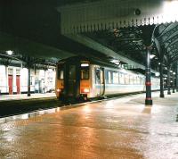 156 435 stands at Platform 3 with a southbound service on a wet evening in February 1998<br><br>[David Panton /02/1998]