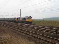 66711 on First GBRF Drax Power Station to Tyne Dock empty northbound working passes Shipton north of York at 10.35 on 25 Mar '10 just after loaded working passed heading south<br><br>[David Pesterfield 25/03/2010]
