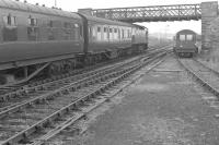 A train for Wick departs Georgemas Junction in July 1963 behind a BRCW Type 2 locomotive.<br><br>[Colin Miller /07/1963]