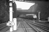 A class 27 emerges from Cowlairs tunnel and brings a train into Queen Street station in March 1974<br>
<br><br>[John McIntyre /03/1974]