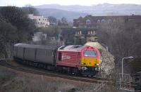 DB Schenker liveried 67018 lifts the evening Fife circle service away from Inverkeithing on 5 April 2010.<br>
<br><br>[Bill Roberton 05/04/2010]