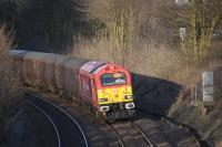 67018 <I>Keith Heller</I> coasts downhill towards Dalgety Bay on 7 April with a returning evening Fife commuter train.<br><br>[Bill Roberton 07/04/2010]