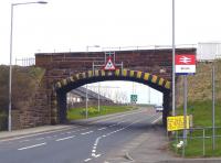 The bridge carrying the line over the A77 at the north end of Girvan station is to be replaced. The project is planned to be completed over 5 days with demolition of the current structure scheduled to commence on 16 April. The bridge is seen here looking east on 9 April 2010. [See image 28605]<br><br>[Colin Miller 09/04/2010]