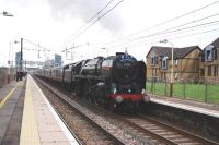 Britannia Pacific 70013 <I>Oliver Cromwell</I> leaving Lockerbie with <I>The Great Britain III</I> after taking on water in the loop south of the station.<br><br>[John Gray 09/04/2010]