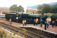 A Fort William to Oban special pauses at Rannoch on 26 September 1999 while 48151 takes on water.<br><br>[Colin Miller 26/09/1999]