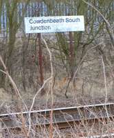 Cowdenbeath South was where the deviation to Cowdenbeath New (the <br>
existing route) left the line through the original station. The fact<br>
that a sign was placed here shows that the junction survived after its signal box closed with the opening of Edinburgh Signalling Centre. However it doesn't appear to have lasted much longer and it's clearly not been thought worthwhile to remove the sign (seen here in April 2010) for that last 30 years or so! <br>
<br><br>[David Panton 14/04/2010]
