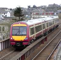 As well as its Fife Circle services Cowdenbeath is the terminus of an hourly train from Edinburgh during the day. Trains arrive and depart from the 'right' platforms which, as the crossover is at the 'wrong' side of the station makes things slightly awkward and the crew have to change ends three times during each visit. Here on 14 April 170 471 performs the middle manoeuvre, running wrong line into the southbound platform. Note the black eye effect of using FSR coloured spares on an SPT liveried set. <br>
<br><br>[David Panton 14/04/2010]