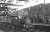 Ex-LMS <I>Jinty</I> no 47326 probably spent as much time as any locomotive under the roof at Carlisle. Seen here taking a break from station pilot duties during a quiet period in July 1965 the 0-6-0T was finally withdrawn by BR from Upperby shed at the end of 1966.<br><br>[K A Gray 31/07/1965]