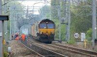 66204 with a westbound container train passing a Network Rail track team on the approach to Birmingham International station on 28 April 2010.<br>
<br><br>[John McIntyre 28/04/2010]