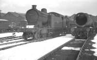 A winter's day in the yards at Darlington works in early 1960. On the left is one of the large Gresley A8 4-6-2 tanks, no 69873, (rebuilt from the original Raven NER D class 4-4-4T) withdrawn from 54A Sunderland South Dock and cut up here in February of that year. <br><br>[K A Gray /02/1960]