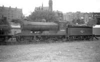 D34 no 62484 <I>Glen Lyon</I> stands with other <I>stored</I> locomotives in the mineral yard alongside Dundee West shed in July 1959. The locomotive was subsequently reallocated to 64G Hawick shed where it continued to operate until final withdrawal in November 1961. [See image 31787]. Disposal was through Arnott Young, Old Kilpatrick, in May 1963.<br><br>[Robin Barbour Collection (Courtesy Bruce McCartney) 30/07/1959]