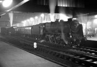 Night scene at Carlisle sometime in 1965. Locomotive is Patriot class 4-6-0 no 45531 <I>Sir Frederick Harrison</I> waiting at platform 3 with a northbound train.<br><br>[Robin Barbour Collection (Courtesy Bruce McCartney) //1965]