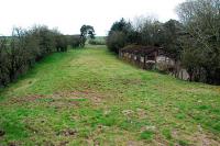 Looking south along the trackbed of the former Solway Junction Railway towards Annan and, ultimately, Cumbria. A narrow gauge line ran down the west (here the right hand side) of the line from Kirtlebridge station to the Mossfoot Ammunition Depot (the building to the right being perhaps part of this former depot).<br><br>[Ewan Crawford 15/04/2010]