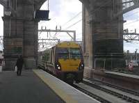 An arrival through the dramatic arch into the new platforms at Glasgow Central.<br><br>[John Yellowlees 12/05/2010]